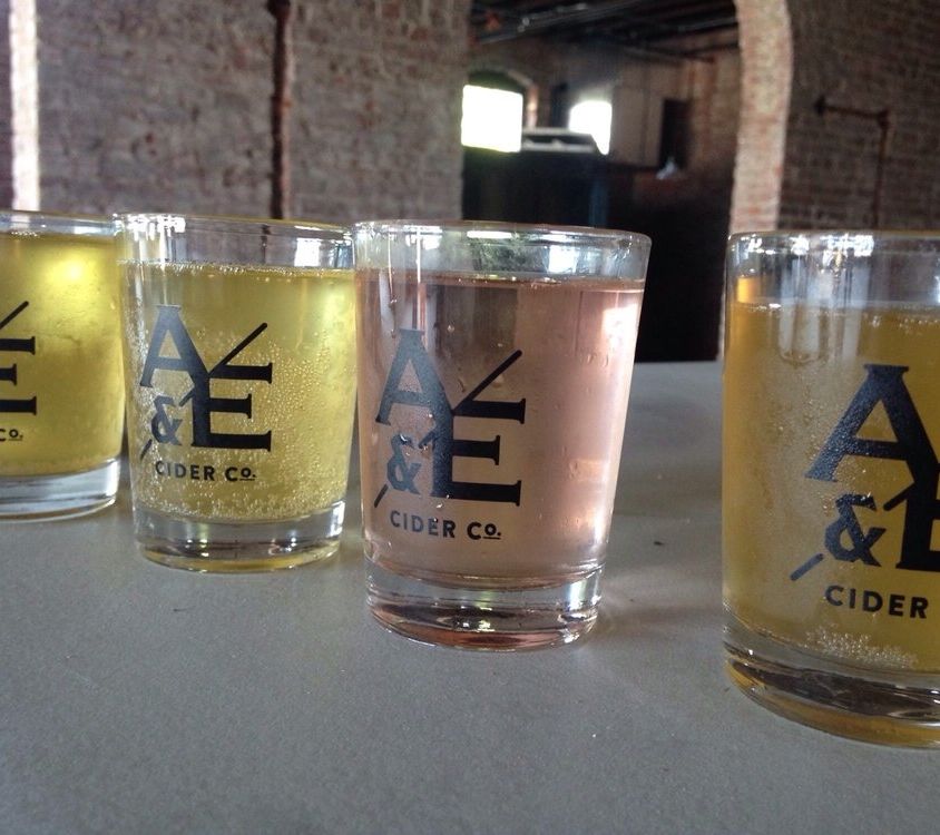 Ash & Elm Ciders lined up on a table.
